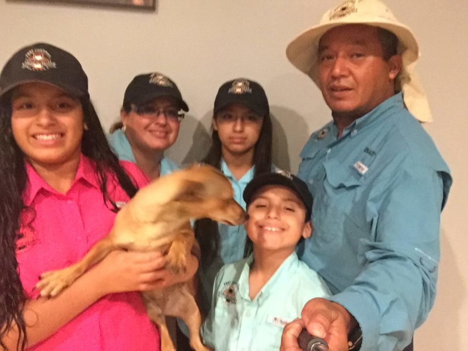 Ignacio Gomez with his family outside their Lehigh Acres home