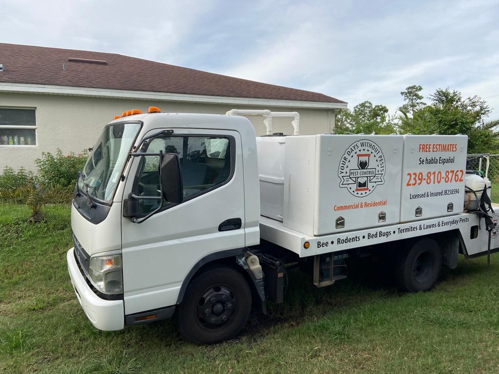 Your Days Without Pests truck parked outside a Southwest Florida home
